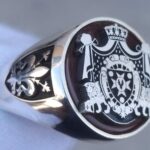 Family Crest Signet Ring - Personalized Deformed Handmade , Antique Style Jewellery, Custom Coat of Arms Gift Ring Ana sayfadaki Aşağıdaki yazı soldaki sağdaki gibi olabilir mi. Signet Rings / Intaglio Carving Gemstone Handmade Custom Designed Jewelry Made Just for You and Together with You: My Handmade Jewelry is a group of stone and metal engraving artists in Grand Bazaar, Istanbul, Turkey. You can contact us through our contact office in New Jersey, USA. (347) 612 8519 Our studio is designed to create unique, one-of-a-kind designs made of special Stones for each of our customers seperately according to their unique wishes. Each product is carefully designed and processed individually. Your special designs come together with precious stones and metals that you have specially selected. Each ring, bracelet, necklace is masterfully handcrafted and offers the perfect harmony of silver and pure gold on precious stones 	Hand Made / Custome Made Jewelry –  The Art of Stone and Metal Our studio is designed to create unique, one-of-a-kind designs made of special Stones for each of our customers seperately according to their unique wishes. Each product is carefully designed and processed individually. Your special designs come together with precious stones and metals that you have specially selected. Each ring, bracelet, necklace is masterfully handcrafted and offers the perfect harmony of silver and pure gold on precious stones